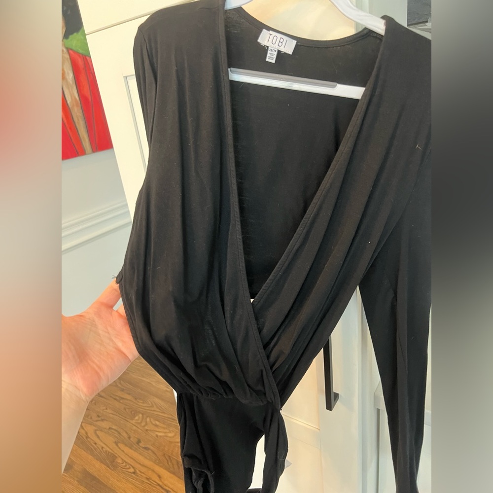 Super cute low cut bodysuit.